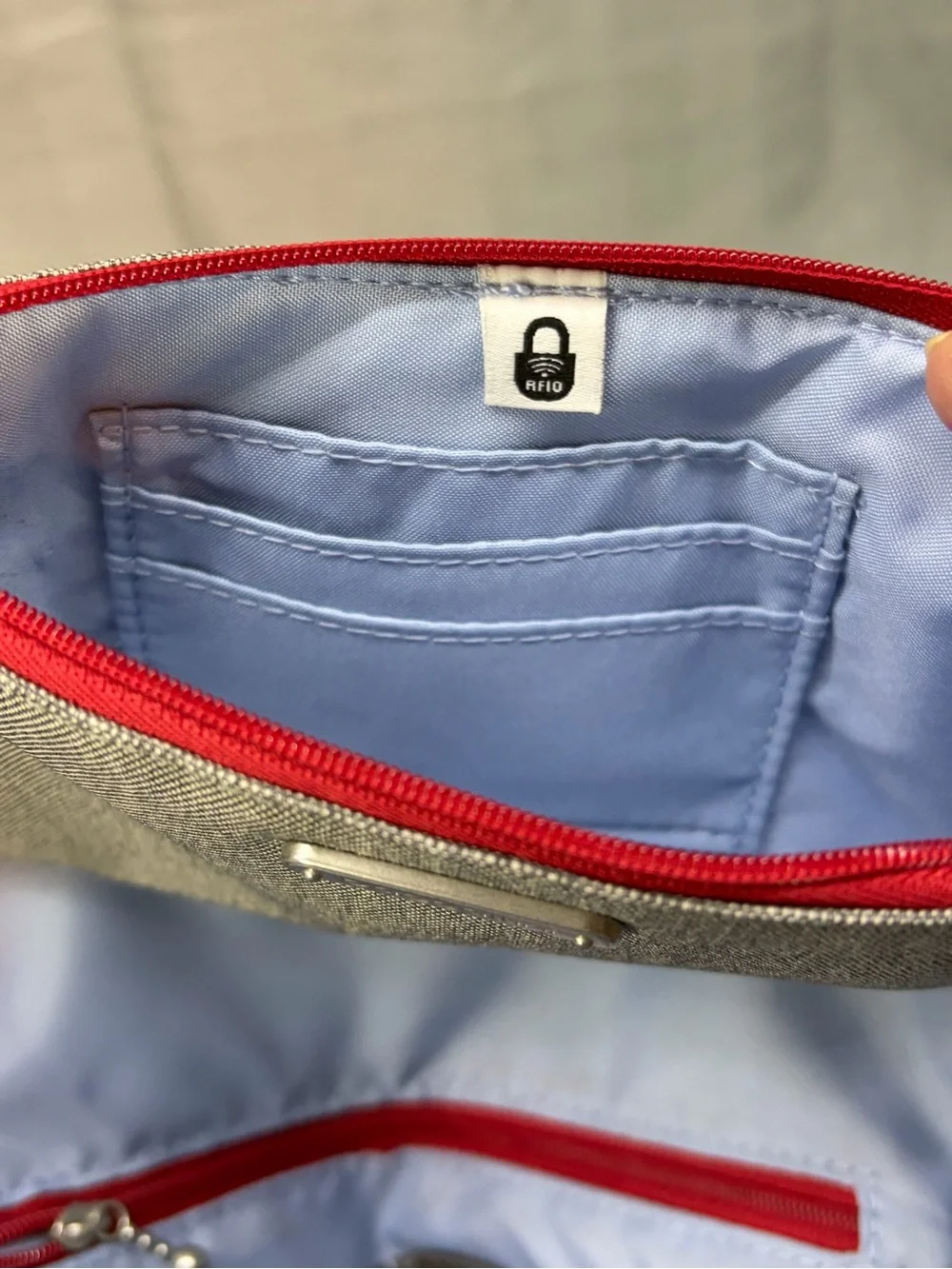 Baggallini all day backpack with handle multi pocket gray exterior blue interior